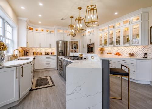 A kitchen with white cabinets.