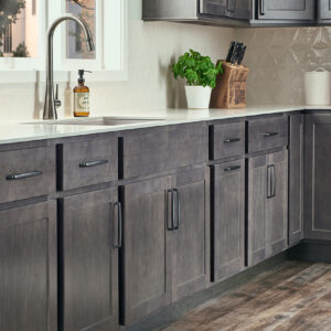 A kitchen with maple ash grey cabinets.