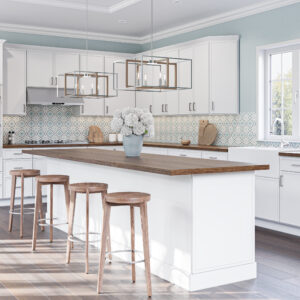 A kitchen with Edgeline White Cabinets.