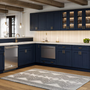 A kitchen with shaker navy cabinets.