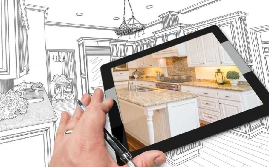 A black and white drawing of a kitchen, with a tablet overlapping the drawing being held by a hand with a pen between the fingers. The screen of the tablet is showing an actual picture of the same kitchen in the drawing.